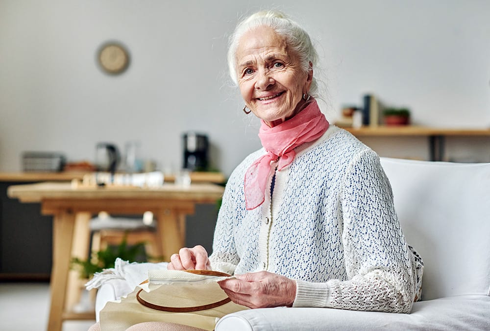 elderly woman happy in a nursing home